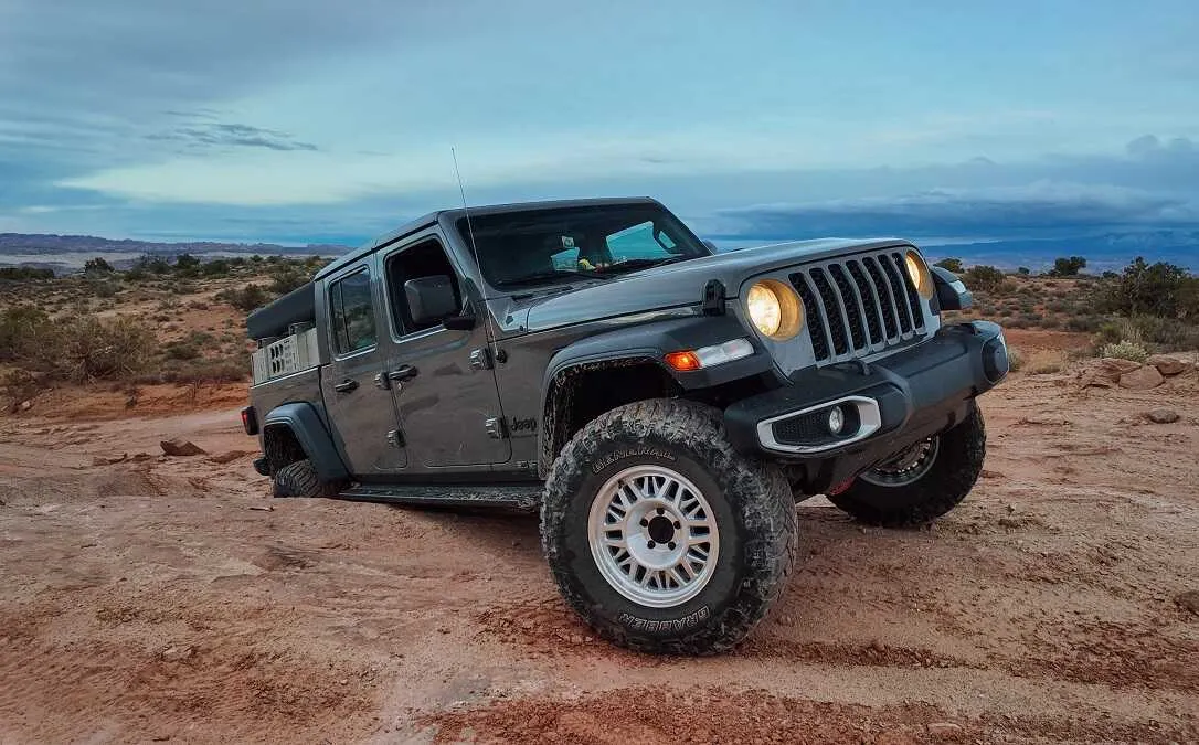 Toyota Gladiator with ASFIR rock sliders on a red dirt trail